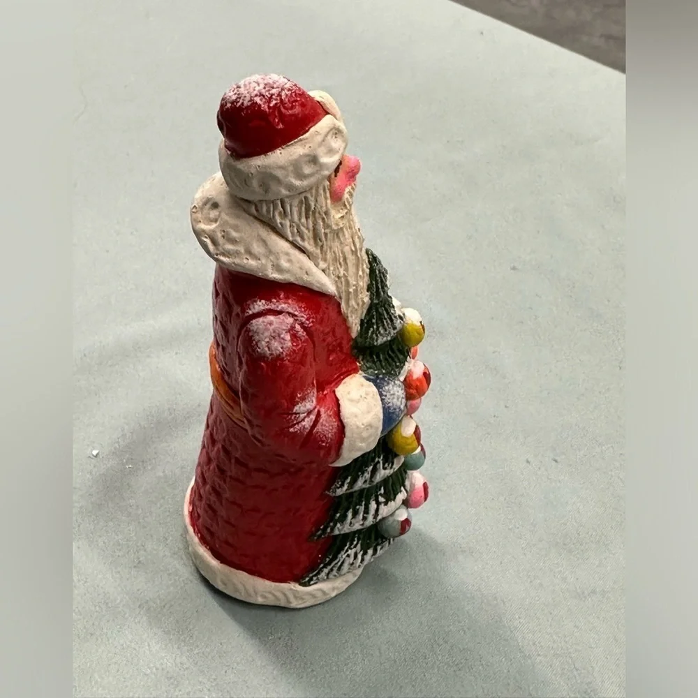 Resin Santa figure carries a special greeting